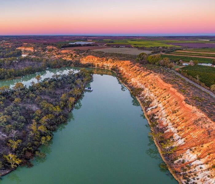 Aerial panoramic landscape of eroding sandstone shores of Murray River at dusk